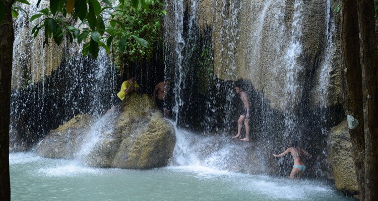 Swimming in the Tier 2 of Erawan Waterfall on a Cloudy Day