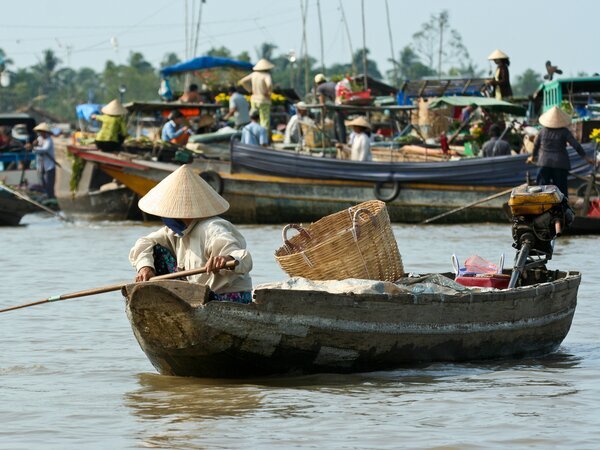 See the bustling floating market scene in Can Tho.