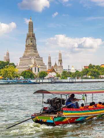 take a long-tail boat ride through Chao Phraya River