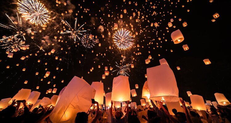 Releasing Sky Lanterns during Yi Peng Festival