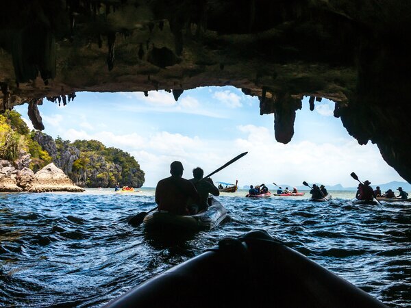 Canoeing through the cave into the lagoon at Phang Nga Bay