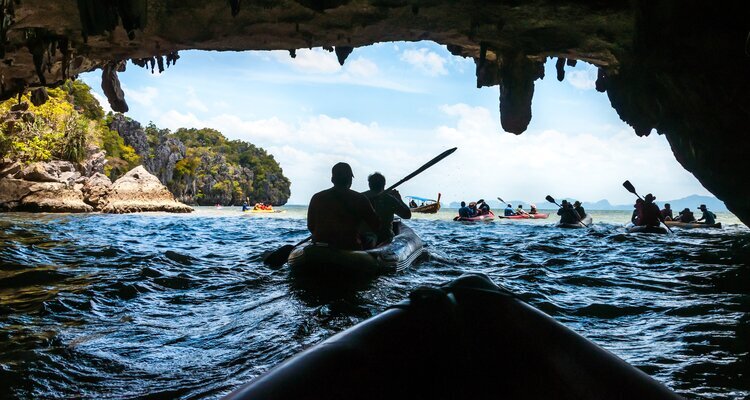 Canoeing through the cave into the lagoon at Phang Nga Bay