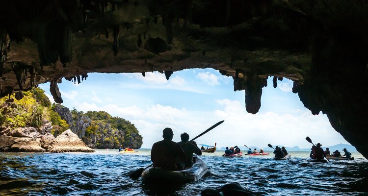 Canoeing through the cave into the lagoon at Phang Nga Bay