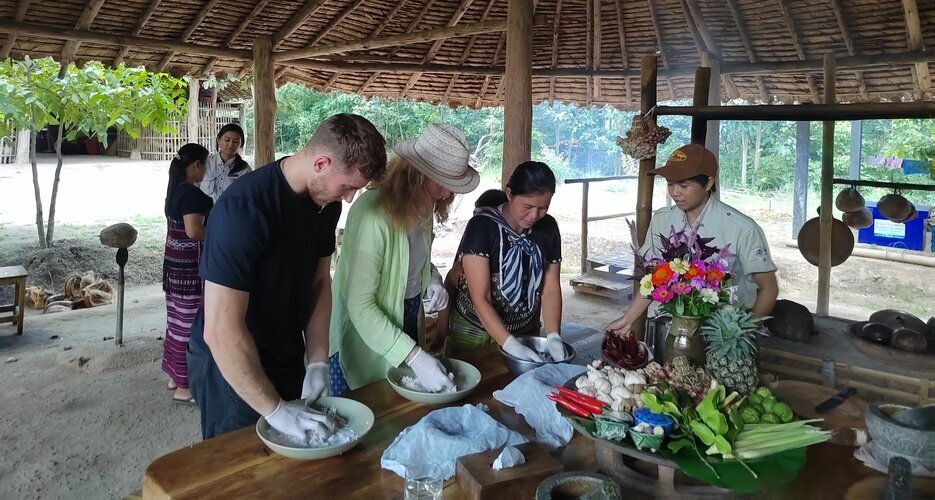 Learning traditional cooking with a local hill tribe host