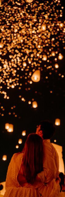 A couple celebrating Yi Peng Lantern Festival together.