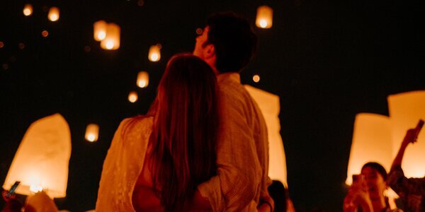 A couple celebrating Yi Peng Lantern Festival together.