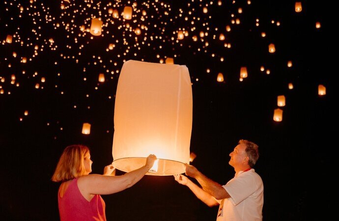 Releasing a sky lantern during the Yi Peng Lantern Festival.