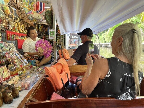 Enjoy the hustle and bustle of the iconic floating market