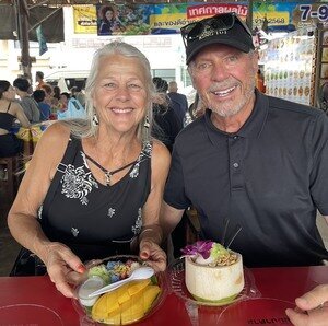 Sampling Thai street food at a local market.