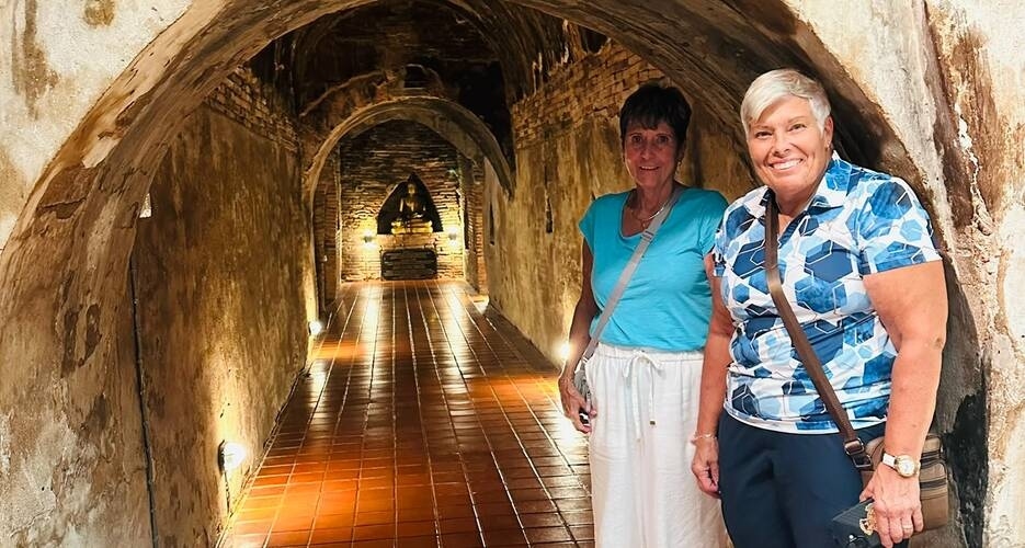 Our Canadian guests, Suansan and Bonny, are exploring the century-old tunnels of Wat Umong.