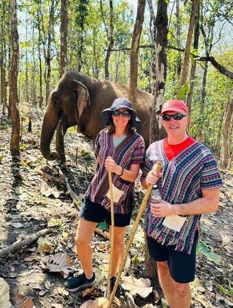Our guests sharing a memorable walk with rescued elephants